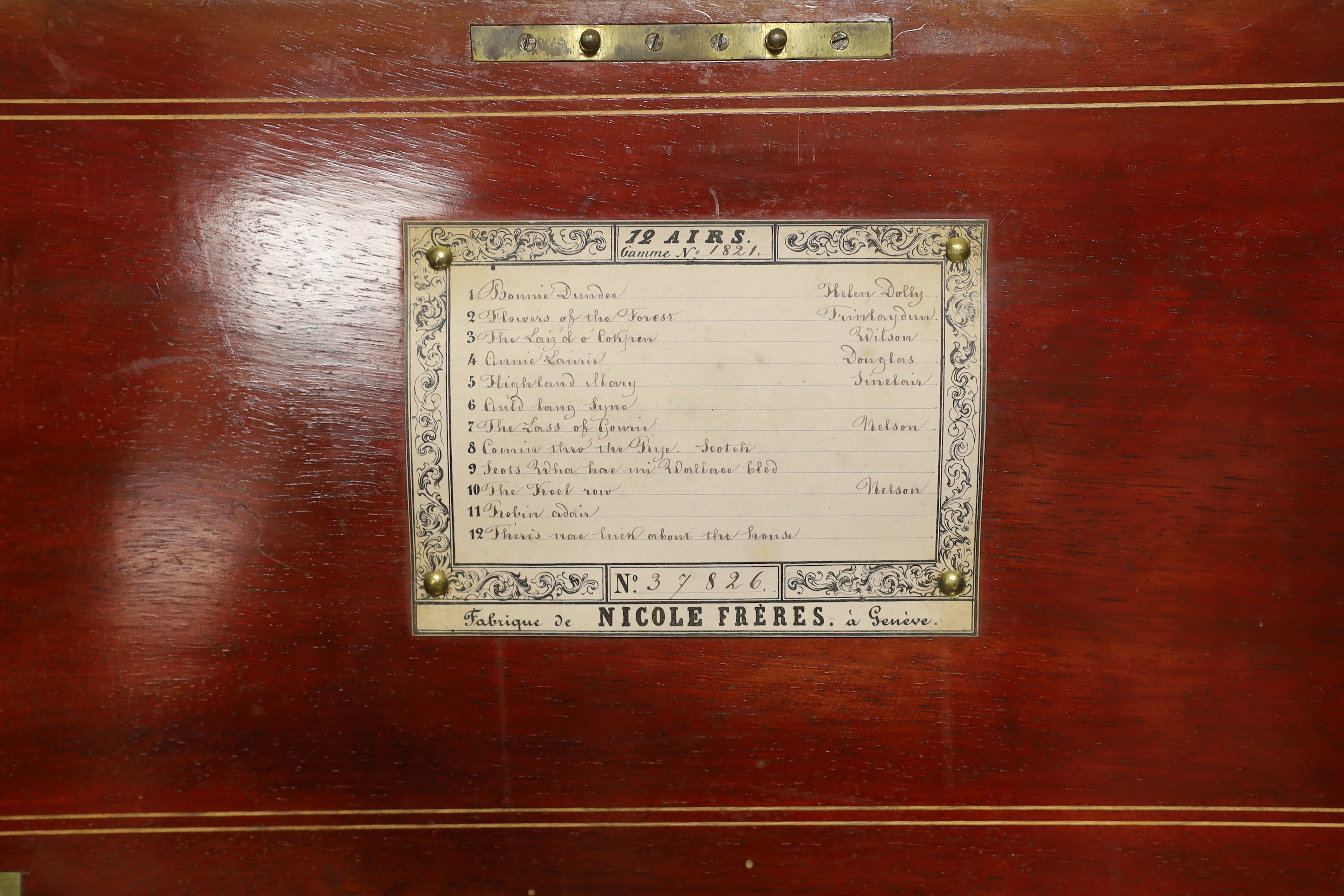 A late 19th century Swiss rosewood inlaid cylinder music box by Nicole Freres, playing twelve airs on one hundred and twenty-nine teeth, barrel 31cm wide, case 53cm wide, 22.5cm deep, 17cm high